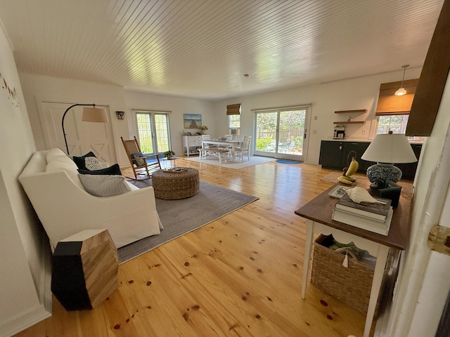 625 Bridge Rd, Eastham, MA 02642 - living area with light wood-style floors and wooden ceiling