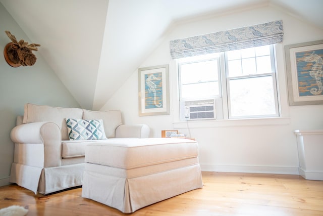 625 Bridge Rd, Eastham, MA 02642 - living area with lofted ceiling, cooling unit, and wood finished floors