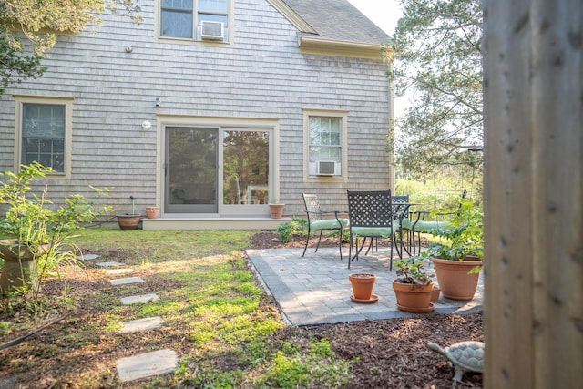 625 Bridge Rd, Eastham, MA 02642 - rear view of house with a patio area, a shingled roof, and cooling unit