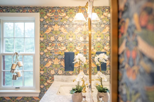 625 Bridge Rd, Eastham, MA 02642 - bathroom with wallpapered walls and vanity