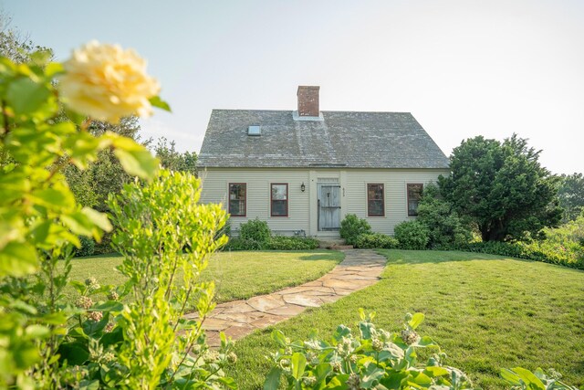 625 Bridge Rd, Eastham, MA 02642 - back of property with a chimney and a lawn