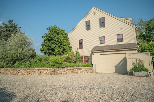 625 Bridge Rd, Eastham, MA 02642 - view of side of property featuring an attached garage and driveway