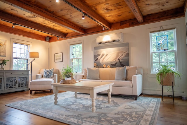 625 Bridge Rd, Eastham, MA 02642 - living room featuring a wall mounted AC, a wooden ceiling with exposed beams, track lighting, healthy amount of natural light, and hardwood / wood-style flooring