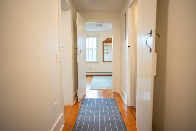 625 Bridge Rd, Eastham, MA 02642 - hall featuring baseboard heating and light wood finished floors