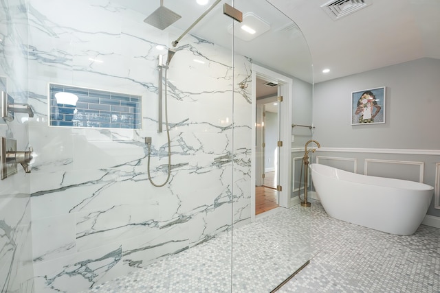 240 Oak St, Centerville, MA 02632 - bathroom featuring a marble finish shower, a soaking tub, a wainscoted wall, and a decorative wall
