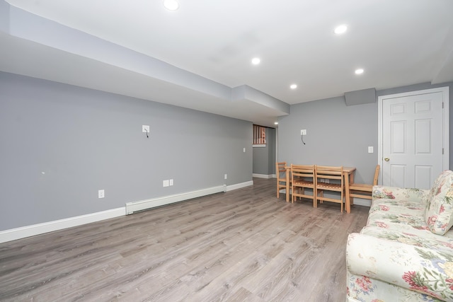 240 Oak St, Centerville, MA 02632 - living area with a baseboard heating unit, light wood-style floors, recessed lighting, and baseboards