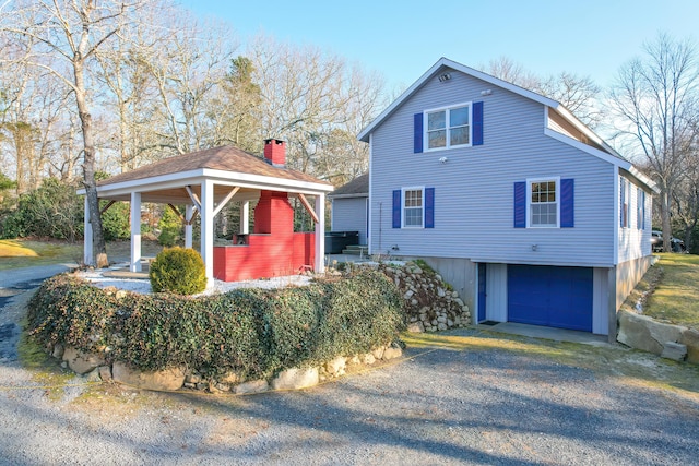 240 Oak St, Centerville, MA 02632 - view of property exterior featuring driveway, a gazebo, and an attached garage