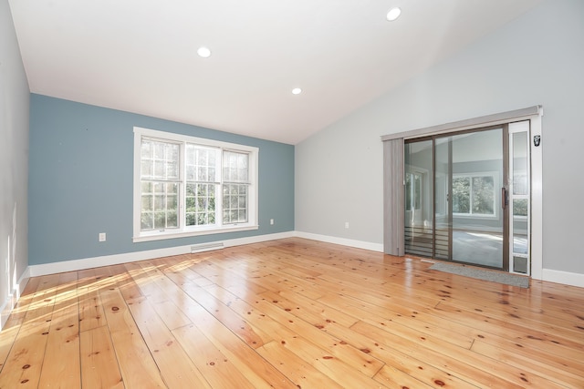240 Oak St, Centerville, MA 02632 - empty room with vaulted ceiling, healthy amount of natural light, hardwood / wood-style floors, baseboards, and recessed lighting