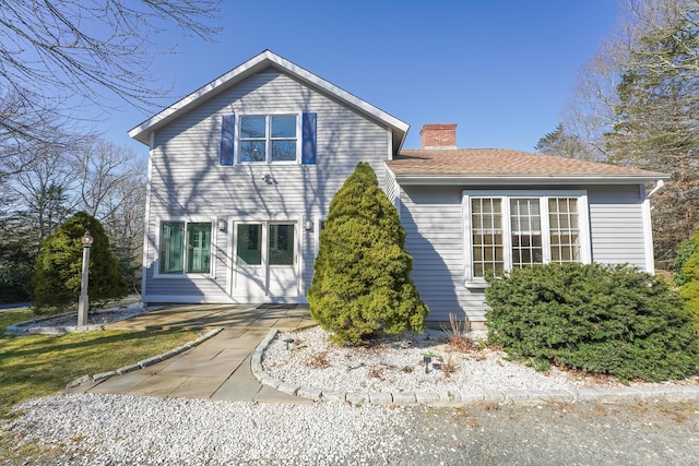 240 Oak St, Centerville, MA 02632 - traditional-style home with a chimney