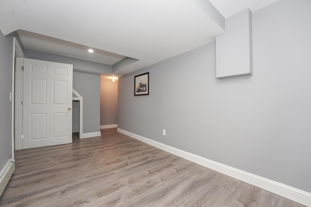 240 Oak St, Centerville, MA 02632 - basement with light wood finished floors, baseboards, a baseboard radiator, and recessed lighting