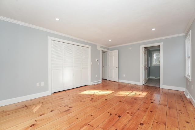 240 Oak St, Centerville, MA 02632 - unfurnished bedroom featuring light wood finished floors, crown molding, baseboards, recessed lighting, and ensuite bath