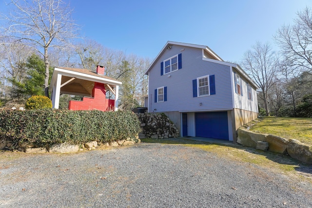 240 Oak St, Centerville, MA 02632 - view of side of home featuring driveway and an attached garage