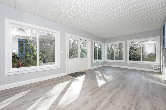 240 Oak St, Centerville, MA 02632 - unfurnished sunroom featuring baseboards, a wooden deck, and wood finished floors