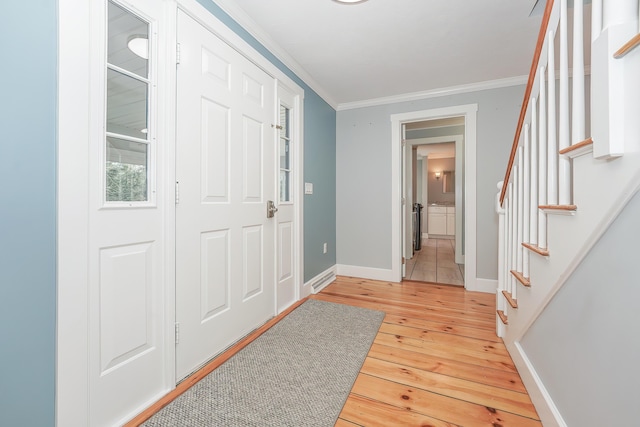 240 Oak St, Centerville, MA 02632 - foyer entrance with stairs, crown molding, light wood-type flooring, and baseboards