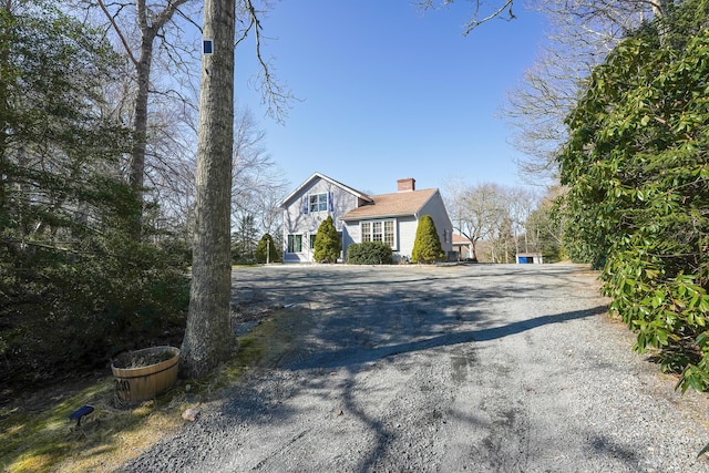 240 Oak St, Centerville, MA 02632 - view of front of home with a chimney and driveway