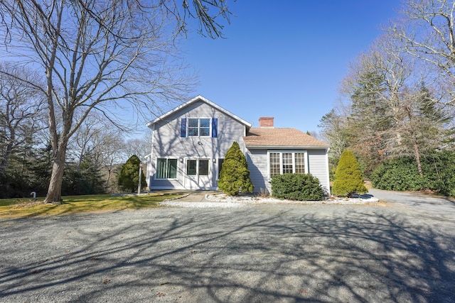 240 Oak St, Centerville, MA 02632 - view of front of house with a chimney
