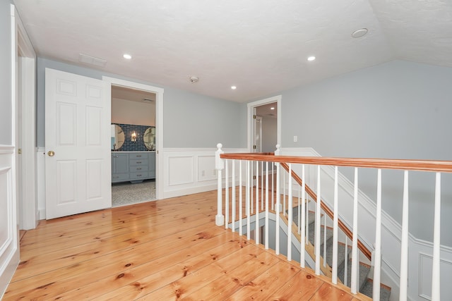 240 Oak St, Centerville, MA 02632 - hallway featuring an upstairs landing, light wood-style floors, vaulted ceiling, and recessed lighting