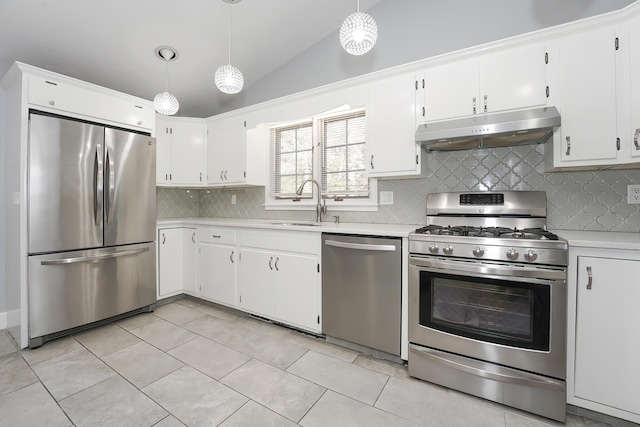 240 Oak St, Centerville, MA 02632 - kitchen featuring stainless steel appliances, under cabinet range hood, lofted ceiling, light countertops, and backsplash