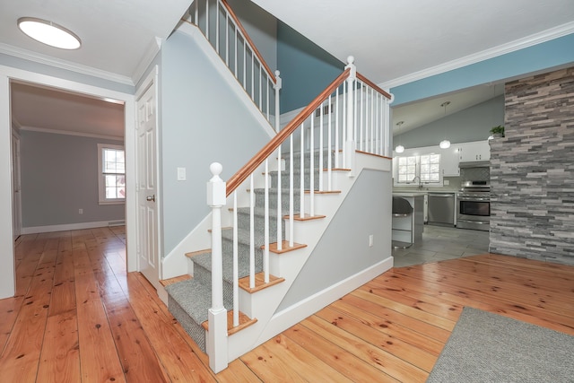 240 Oak St, Centerville, MA 02632 - stairs featuring hardwood / wood-style flooring, vaulted ceiling, healthy amount of natural light, crown molding, and baseboards