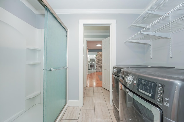 240 Oak St, Centerville, MA 02632 - washroom with washing machine and dryer and crown molding