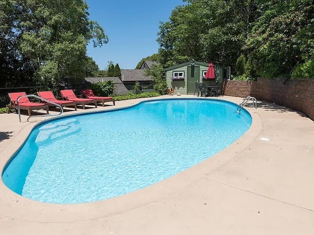 118 Driftwood Ln, South Yarmouth, MA 02664 - view of swimming pool with a patio and an outbuilding