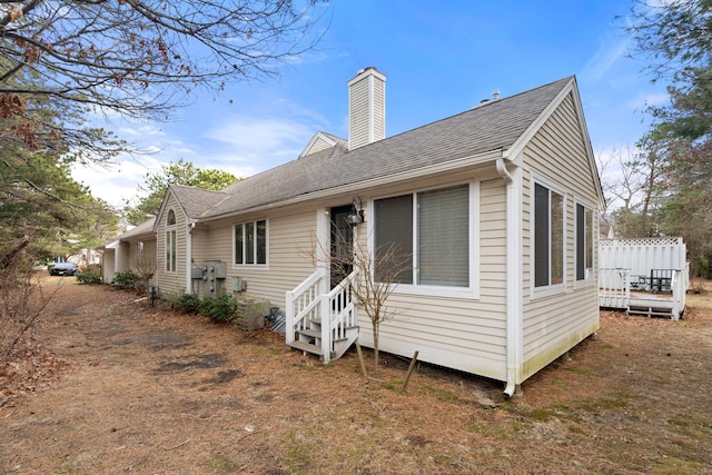 2 Pacific Ave, Mashpee, MA 02649 - rear view of property featuring entry steps, a chimney, and roof with shingles