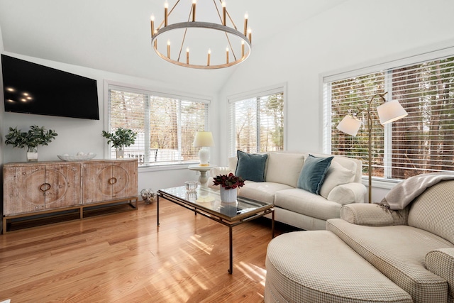 2 Pacific Ave, Mashpee, MA 02649 - living area with a chandelier, light wood-type flooring, and lofted ceiling