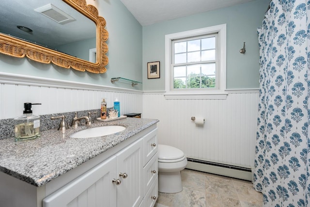 bathroom featuring vanity, toilet, and a baseboard radiator