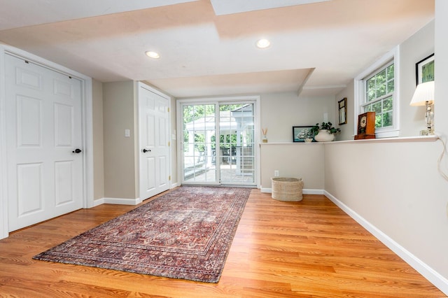 doorway with light wood-type flooring