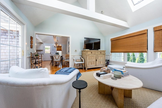 44 Leeward Run, South Yarmouth, MA 02664 - living room with a chandelier, wood finished floors, a skylight, and high vaulted ceiling