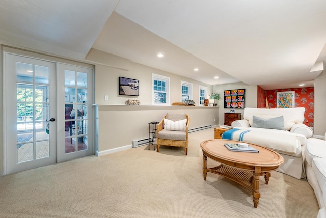 carpeted living room with french doors and a baseboard heating unit