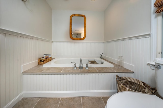 bathroom featuring a bath and tile patterned flooring