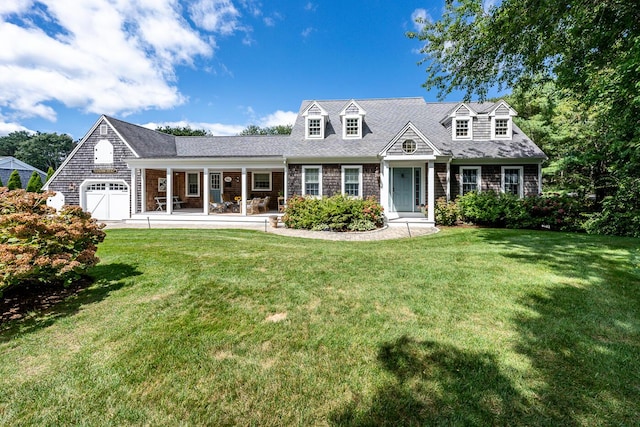 cape cod home featuring a garage, a front lawn, and a porch