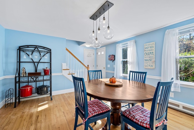 dining space featuring light hardwood / wood-style floors