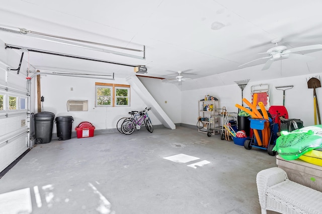 garage featuring ceiling fan and a garage door opener