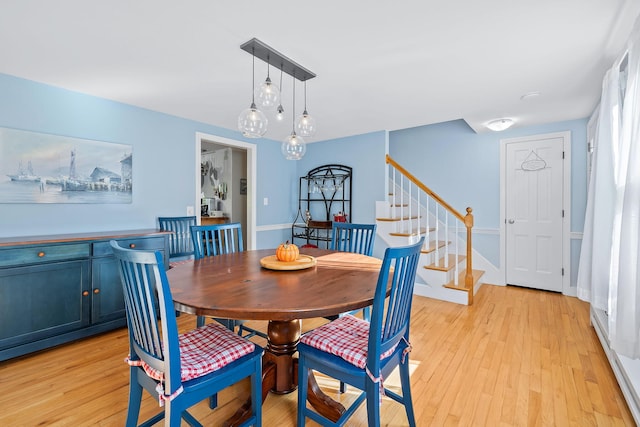 dining room with light hardwood / wood-style floors