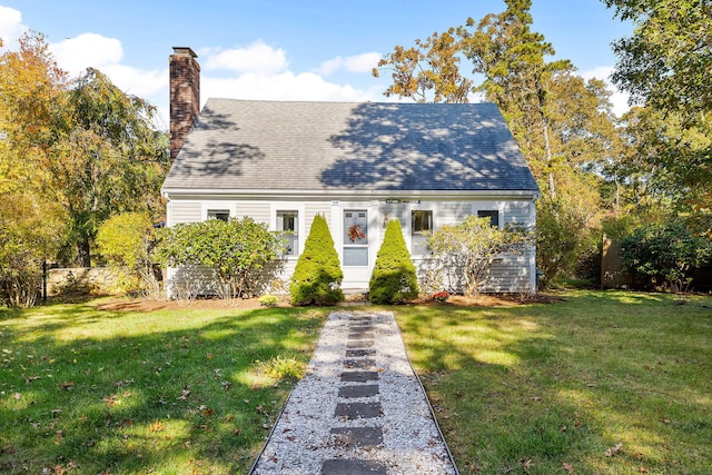 new england style home with a front yard