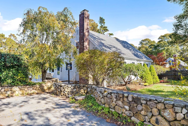 view of side of property with a patio