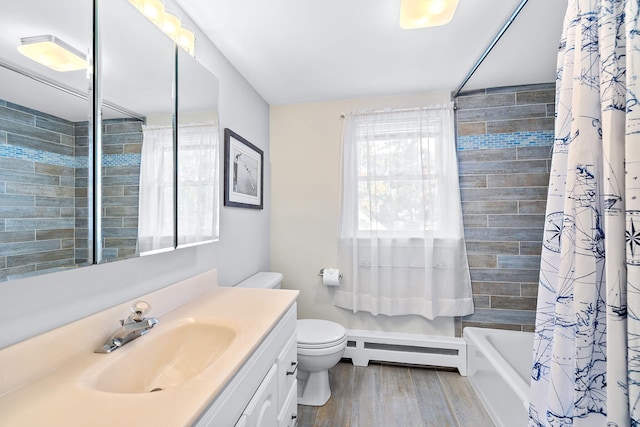 full bathroom with shower / tub combo with curtain, toilet, vanity, hardwood / wood-style floors, and a baseboard heating unit