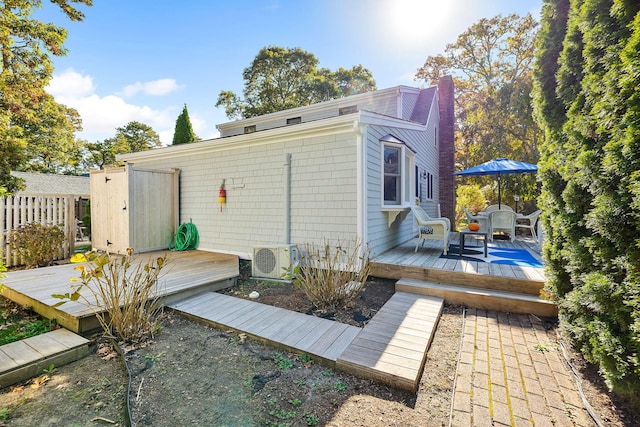 back of house featuring a deck and ac unit