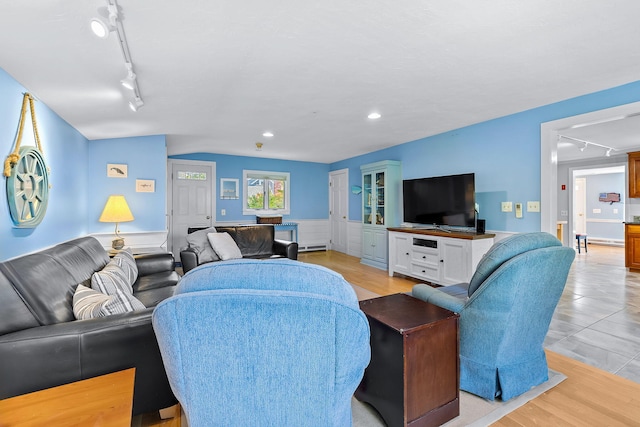 living room featuring rail lighting