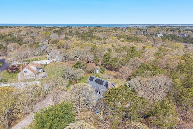 aerial view of property's location with a forest