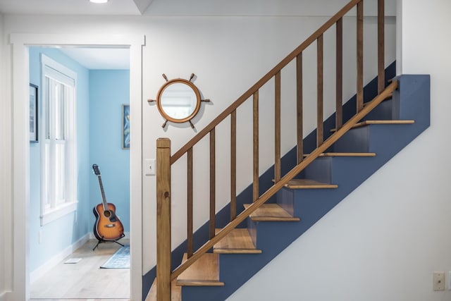 stairway featuring baseboards