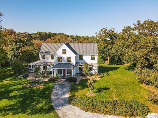 modern inspired farmhouse with a porch and a front yard