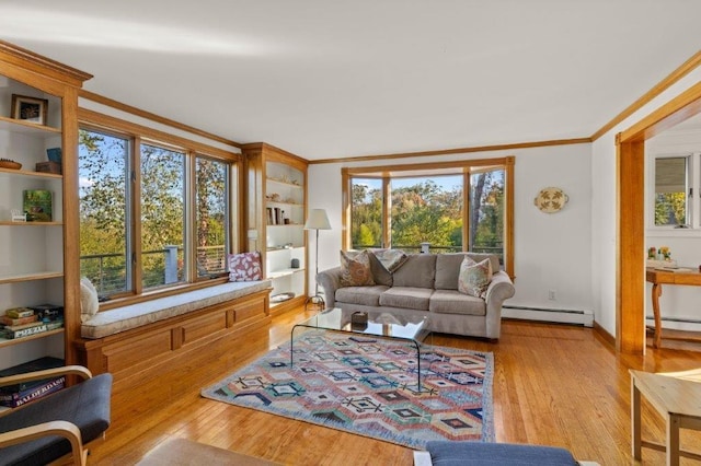 living room with light hardwood / wood-style floors, crown molding, a baseboard radiator, and plenty of natural light