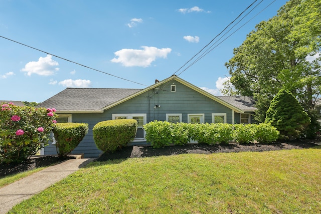57 Oak St, Wareham, MA 02571 - view of front of home with a front lawn and a shingled roof