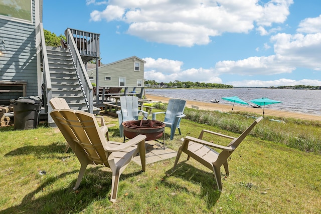 57 Oak St, Wareham, MA 02571 - view of patio with an outdoor fire pit, stairs, and a deck with water view