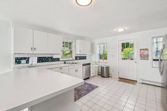 57 Oak St, Wareham, MA 02571 - kitchen featuring stainless steel dishwasher, a sink, light countertops, and plenty of natural light