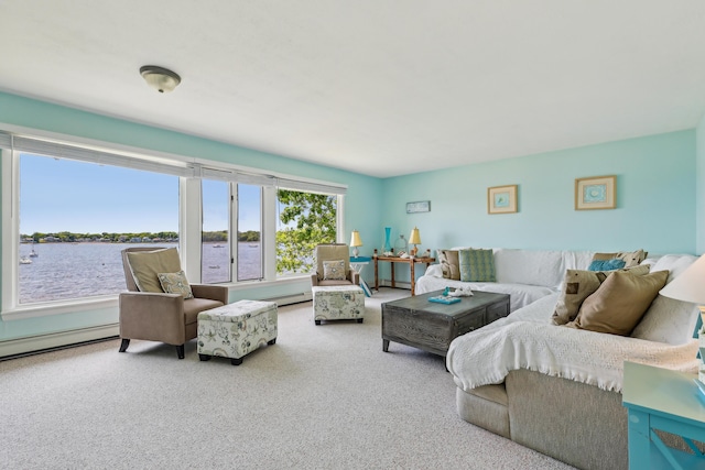 57 Oak St, Wareham, MA 02571 - carpeted living room featuring a baseboard heating unit and a water view