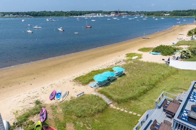 aerial view with a water view and a beach view